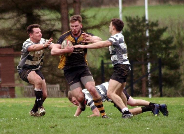 Llangwm try-scorer Josh Hicks on the charge